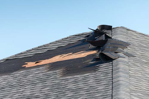 Peeled off shingles from storm